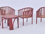 three red chairs and a table with a small table in the middle of them