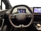 the interior of a car with a steering wheel, dashboard, and display screen