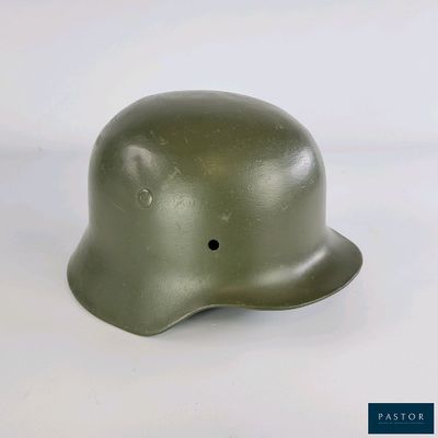 une image représentant un casque percé d'un trou au milieu