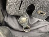 a close up of a purse with a keychain on it