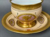 an image of a cup and saucer on a saucer on a table