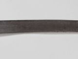 a knife that is laying on a white surface