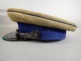 a blue hat with a brown band and a black buckle