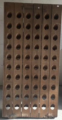 a stack of wooden crates with holes on them