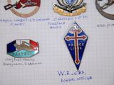 a lot of badges that are on a piece of paper