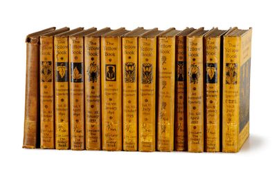 books are lined up in a row on a white surface
