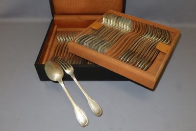 a wooden box with silverware in it on a table