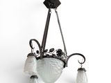 an image of a chandelier with three glass shades hanging from the ceiling