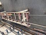 a picture of a machine that is working on pipes