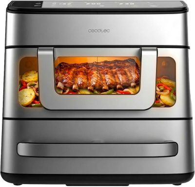 un four à friteuse à air chaud contenant de la viande et des légumes