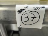 a sticker that has been written on a metal bar