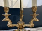 an image of a table lamp with three candles on it