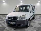 a white van that is parked on a checkered floor