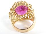 an image of a gold ring with a pink stone in the center