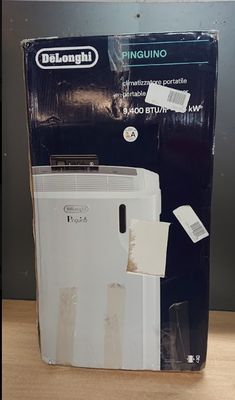 a white refrigerator sitting on top of a wooden table