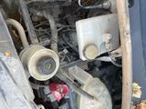 a close up of a car ' s engine with its hood open