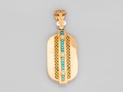 un pendentif en or 18 carats et diamants, orné d'émeraudes