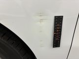 a close up of a sticker on the side of a white car