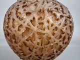 a close up of a glass vase with a pattern on it