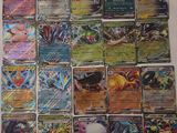 a lot of pokemon cards that are on the table
