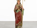 an image of a statue of a man holding a staff