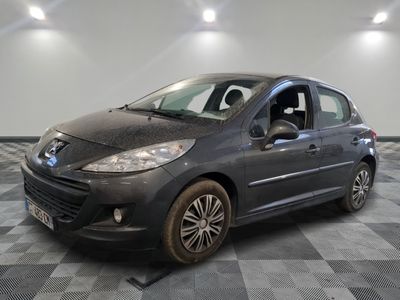 a picture of a grey car parked in a garage