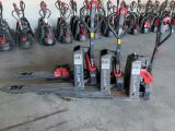many different types of forklifts lined up in a warehouse