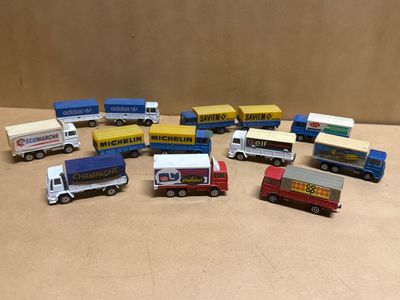 a lot of toy trucks that are sitting on a table