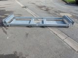 an image of a flat bed in the middle of a parking lot