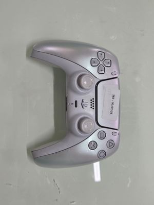 a close up of a video game controller on a wall