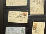 several old envelopes with stamps are sitting on a table