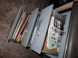 a filing cabinet with a bunch of papers inside of it