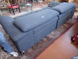 a couch that is sitting on a rug in a room