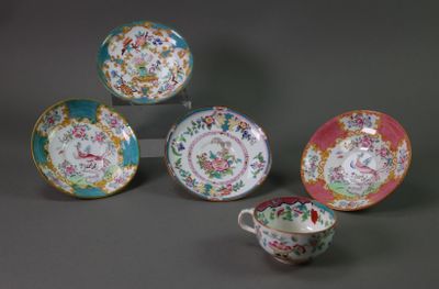 four different types of china plates and cups on a gray surface
