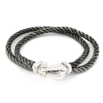 a black rope bracelet with a silver clasp on a white background