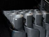 many chairs that are lined up in a row