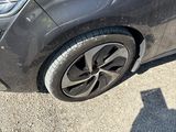 a black car parked on the side of the road