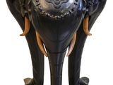 a black table with two elephants on top of it