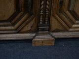a close up of a wooden door with a clock on it