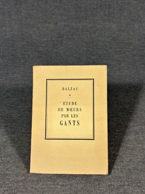 a book sitting on top of a table next to a black table