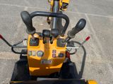 a small yellow machine that is parked in the parking lot
