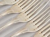 five forks that are sitting on top of each other