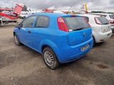 a blue car parked in a parking lot with other cars