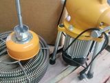 a yellow blower sitting on a pallet next to a yellow blower