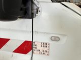 a white van with a red stripe on the side of it
