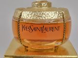 a bottle of champagne sitting on top of a gold box