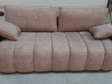 a couch that is sitting in a garage