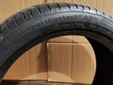 a close up of a tire on a cardboard box with a cardboard box in the background