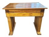 an old wooden desk with a drawer on top of it