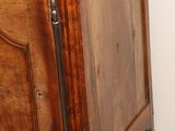 a small wooden cabinet with a drawer on top of it